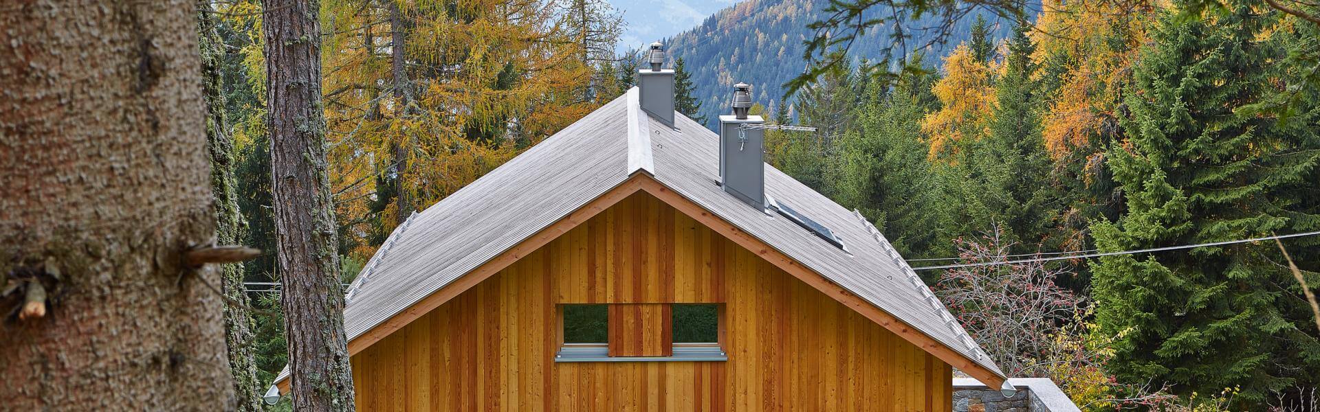 Raffeiner Ferienhaus Holzbau Wald Vigiljoch